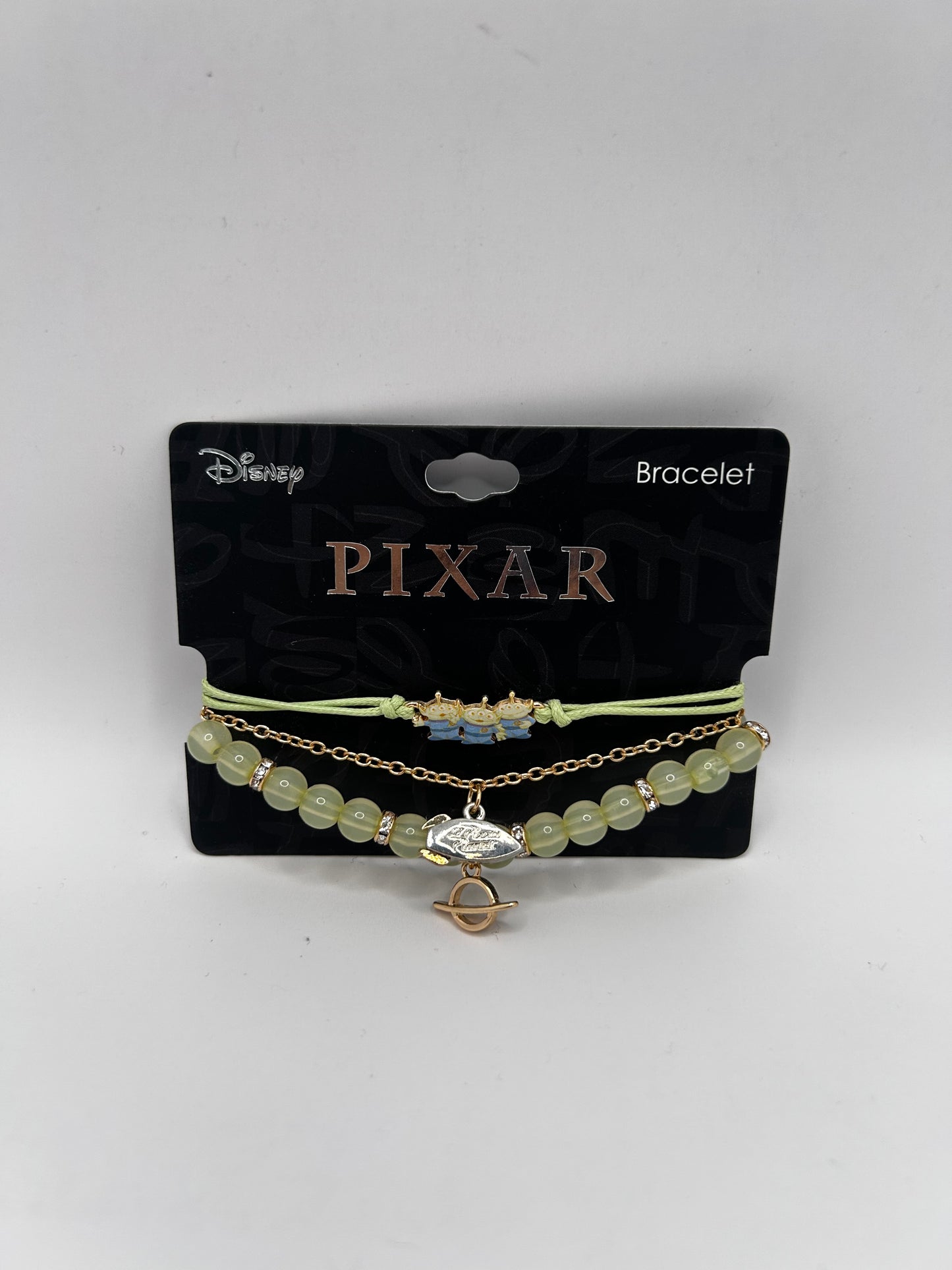 Set de Pulseras Disney Pixar: Toy Story – "The Claw" & Pizza Planet